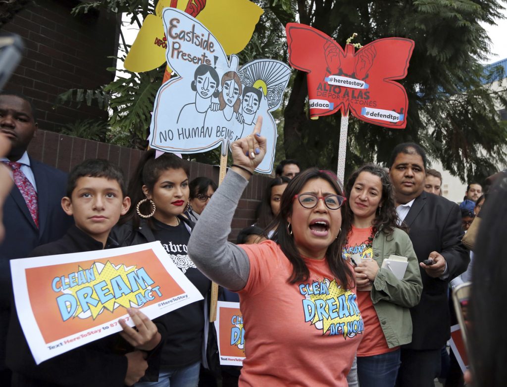 Immigration Democrats Cristina Jimenez speaks to demonstrators urging the Democratic Party to protect the Deferred Action for Childhood Arrivals Act (DACA) rally outside the office of California Democratic Sen. Dianne Feinstein in Los Angeles Wednesday, Jan. 3, 2018. California has the largest number of people who are affected by the law, also known as the Dream Act. (Reed Saxon/AP Photo)