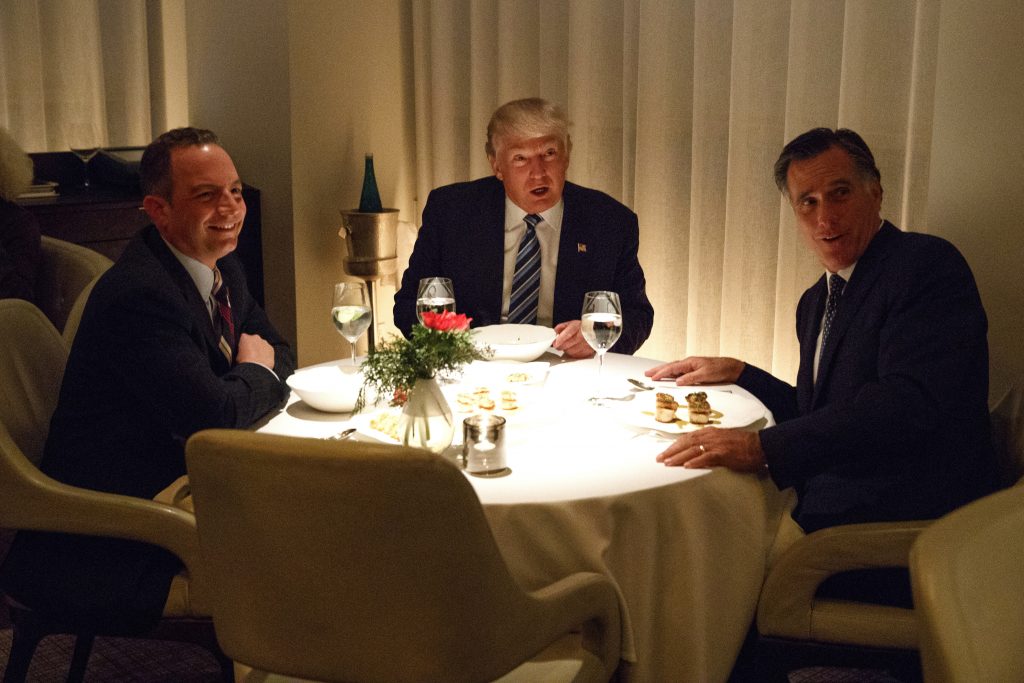 President-elect Donald Trump, center, eats dinner with Mitt Romney, right, and Trump Chief of Staff Reince Priebus at Jean-Georges restaurant, Tuesday, Nov. 29, 2016, in New York.