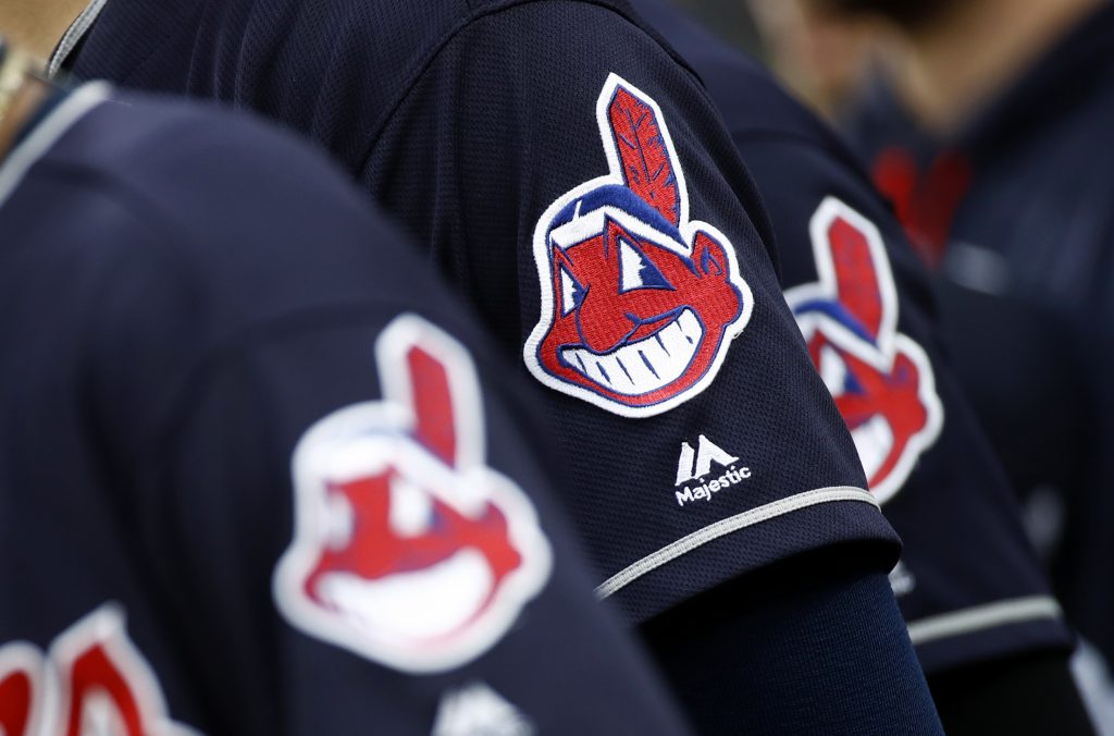 Members of the Cleveland Indians wear uniforms featuring mascot Chief Wahoo as they stand on the field for the national anthem before a baseball game against the Baltimore Orioles in Baltimore, Monday, June 19, 2017.