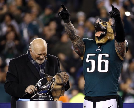 Philadelphia Eagles' Chris Long wears a mask after the NFL football NFC championship game against the Minnesota Vikings Sunday, Jan. 21, 2018, in Philadelphia. The Eagles won 38-7 to advance to Super Bowl LII. (AP Photo/Patrick Semansky)