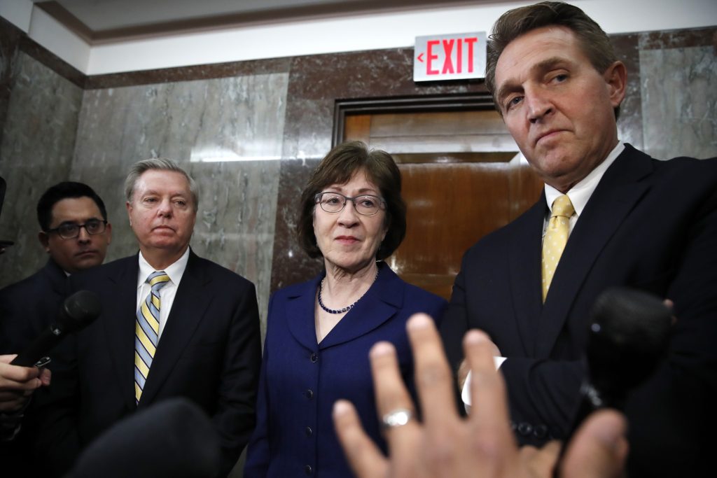 Lindsey Graham, Susan Collins, Jeff Flake Sen. Lindsey Graham, R-S.C., left, Sen. Susan Collins, R-Maine, and Sen. Jeff Flake, R-Ariz., listen to a question from the media after attending a bipartisan meeting of senators, Monday Jan. 22, 2018, on Capitol Hill in Washington on day three of the government shutdown. (AP Photo/Jacquelyn Martin)