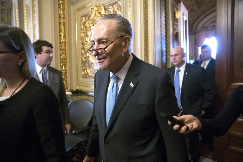 Chuck Schumer Senate Minority Leader Chuck Schumer, D-N.Y., heads to the chamber with fellow Democrats for a procedural vote aimed at reopening the government, at the Capitol in Washington, Monday, Jan. 22, 2018.
