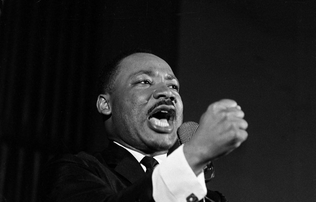 KING Dr. Martin Luther King Jr. shakes his fist during a speech in Selma, Ala., Feb. 12, 1965. King was engaged in a battle with Sheriff Jim Clark over voting rights and voter registration in Selma. (AP Photo/Horace Cort)