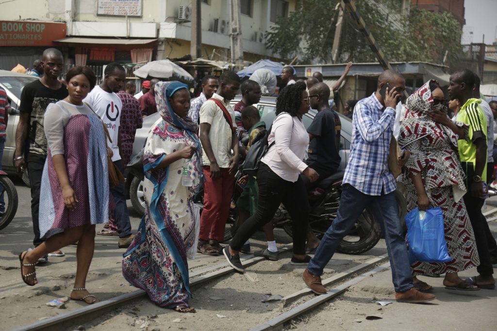 Nigeria Trump Immigration World Reactions Pedestrian cross a rail line in Lagos, Nigeria, Friday, Jan. 12, 2018. Africans were shocked on Friday to find President Donald Trump had finally taken an interest in their continent. But it wasn't what people had hoped for. Using vulgar language, Trump on Thursday questioned why the U.S. would accept more immigrants from Haiti and