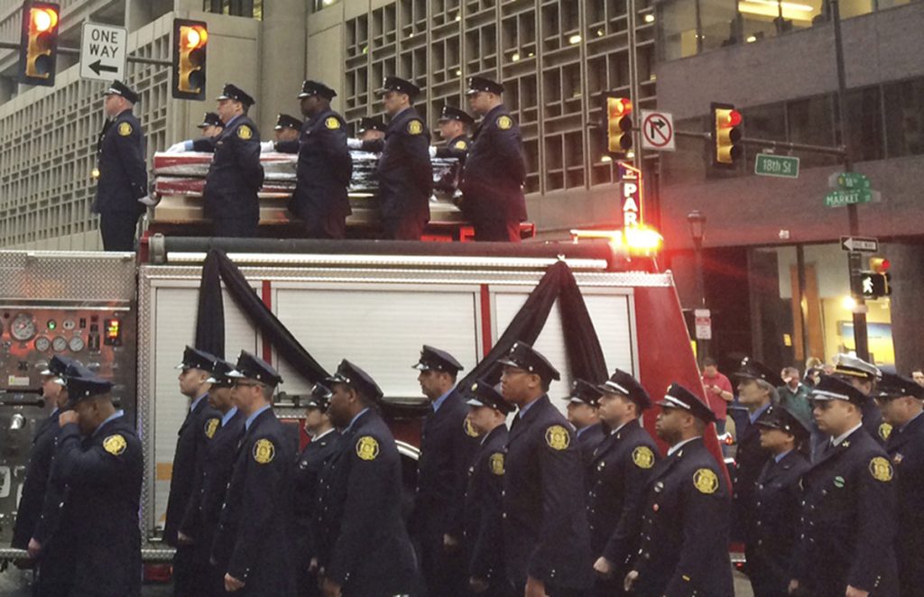Row Home Fire Firefighter Killed Firefighters line up as the body of Philadelphia firefighter Lt. Matthew LeTourneau is carried on top of a firetruck during a funeral procession on Friday, Jan. 12, 2018 in Philadelphia. Officials say the funeral mass for Lt. Matthew LeTourneau will be held Friday at the Cathedral Basilica of Saints Peter and Paul in Philadelphia. The 11-year veteran was pulled from the home on Saturday by fellow firefighters and taken to a hospital, where he was later pronounced dead.