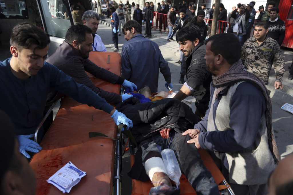 Afghanistan An injured man is moved to a stretcher outside a hospital following a suicide attack in Kabul, Afghanistan, Saturday Jan. 27, 2018. A suicide car bomber killed at least 40 people and wounded about 140 more in an attack claimed by the Taliban on Saturday in Afghanistan's capital Kabul, authorities said. (Rahmat Gul/AP Photo)