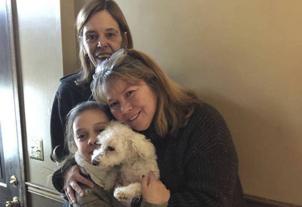 Monica Newhard,Christina Hartman,Helen Welch In this photo provided by Jessica Hartman, Monica Newhard, (right), and her granddaughter, Helen Welch, hold their pet bichon frise, Zoey, as the dog’s rescuer, Christina Hartman, stands behind them, Wednesday, Jan. 3, 2018, in Palmerton, Pa. Newhard’s brother says an eagle snatched Zoey from the yard. (Jessica Hartman via AP)