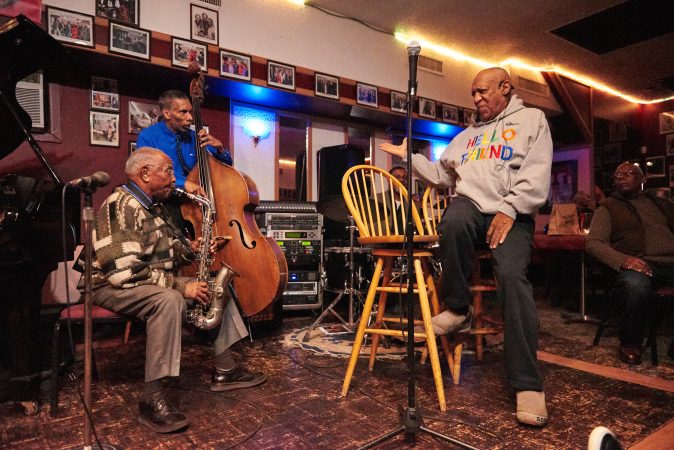 Bill Cosby talks to the band while performing in Germantown Monday night