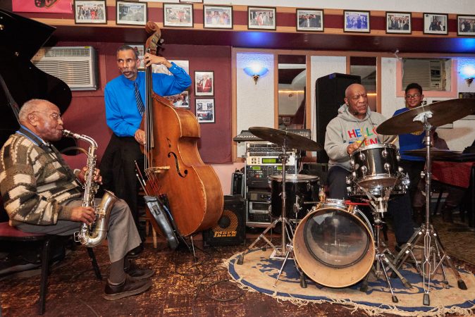 Bill Cosby takes a turn at the drums during Monday night's performance