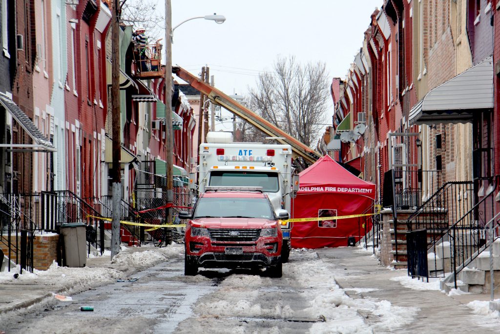 EDF09A57-710D-4E1D-999A-EB80FC52C0EF The investigation continues at the scene of a row house fire on North Colorado Street that killed a firefighter and a 61-year-old resident.