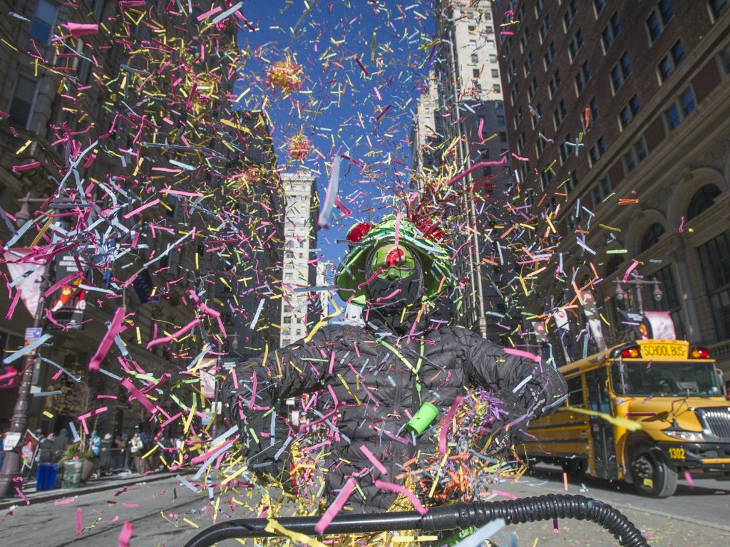 Mummers 2018 – -12 Brendan Ireland, a member of Philadelphians for Mummery tossed confetti as he marched the parade route.