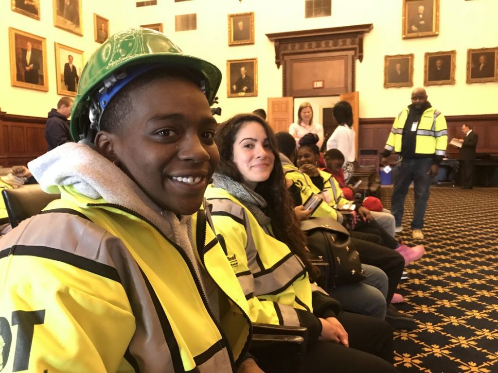 NBjobtrainingx1200.full Taryn Canty-Reed, 20, (front), says young people in her generation have experienced abandonment and have also abandoned themselves. Now it’s time for them to chase opportunities, said the YouthBuild Philadelphia Charter School student attending a press conference in City Hall Tuesday, Jan. 9, 2018. (Jane M. Von Bergen/The Notebook)