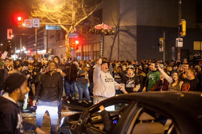 Eagles Fans celebrate on South Broad Street after their win over the Minnesota Vikings in the NFC Championship Game Sunday. (Brad Larrison for WHYY)