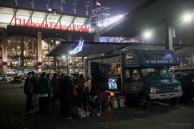 Eagles fans watch the NFC Championship Game against the Minnesota Vikings from their R.V in the parking lot of Lincoln Financial Field Sunday night. (Brad Larrison for WHYY)