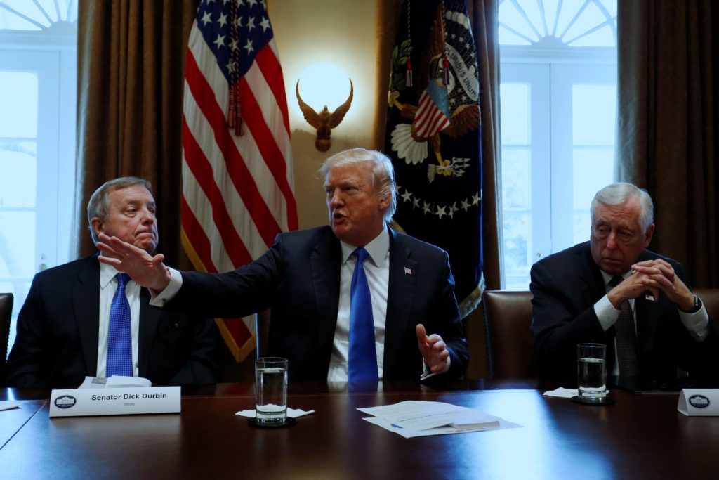 Trump holds a bipartisan meeting with legislators on immigration reform at the White House in Washington U.S. President Donald Trump, flanked by U.S. Senator Dick Durbin (D-IL) and Representative Steny Hoyer (D-MD), holds a bipartisan meeting with legislators on immigration reform on January 9, 2018. REUTERS/Jonathan Ernst)