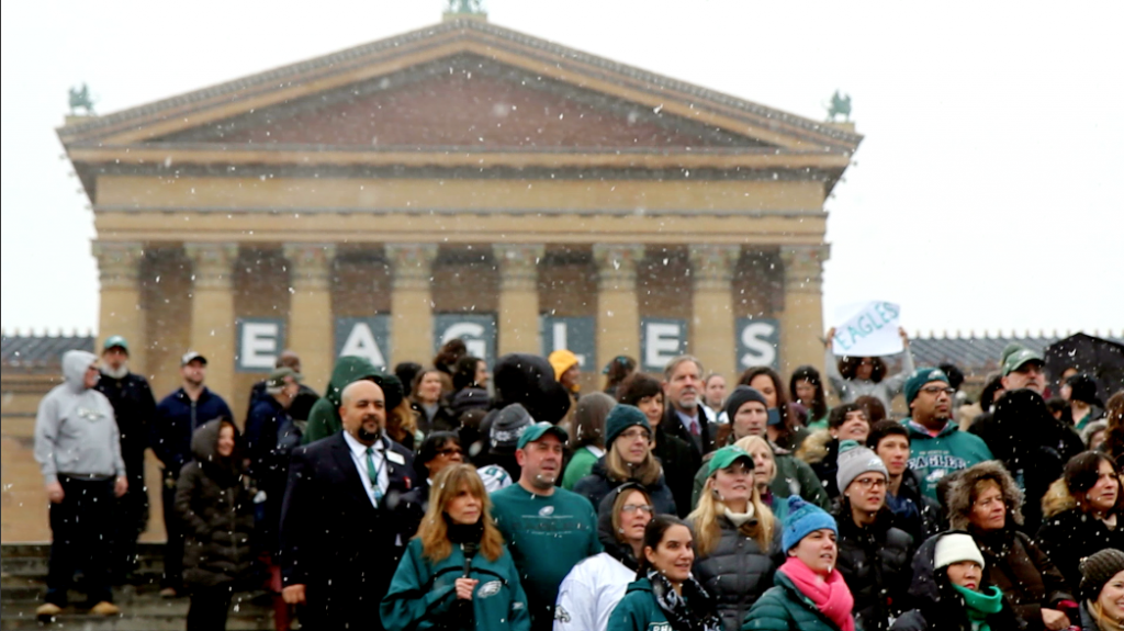 PMA staff gathers to sing the Eagles Fight Song ahead of the Super Bowl. (Kimberly Paynter/WHYY)