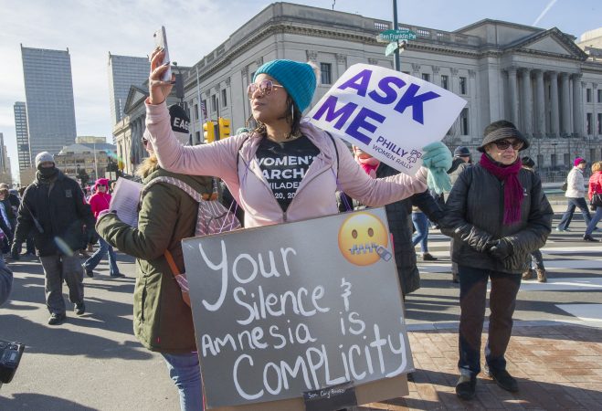 March volunteer, Nicole Treadwell, takes a selfie along the Parkway. (Jonathan Wilson for WHYY)