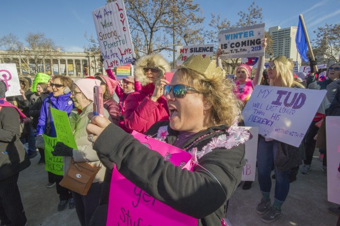 Marchers cheer the Drum Like A Lady group at Logan Circle. (Jonathan Wilson for WHYY)