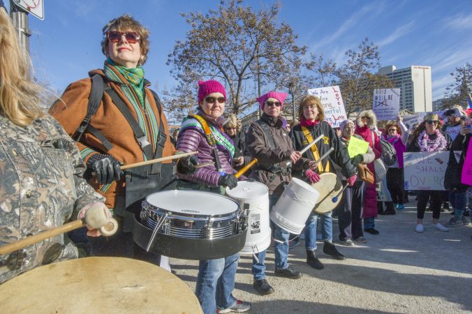Members of the Drum Like a Lady group entertain marchers. (Jonathan Wilson for WHYY)