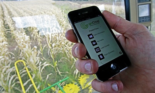 In this file photo, Tony Pouliot demonstrates the goCrop app on his mobile photo in the cab of his combine on his farm in Westford, Vt. (Toby Talbot/AP)