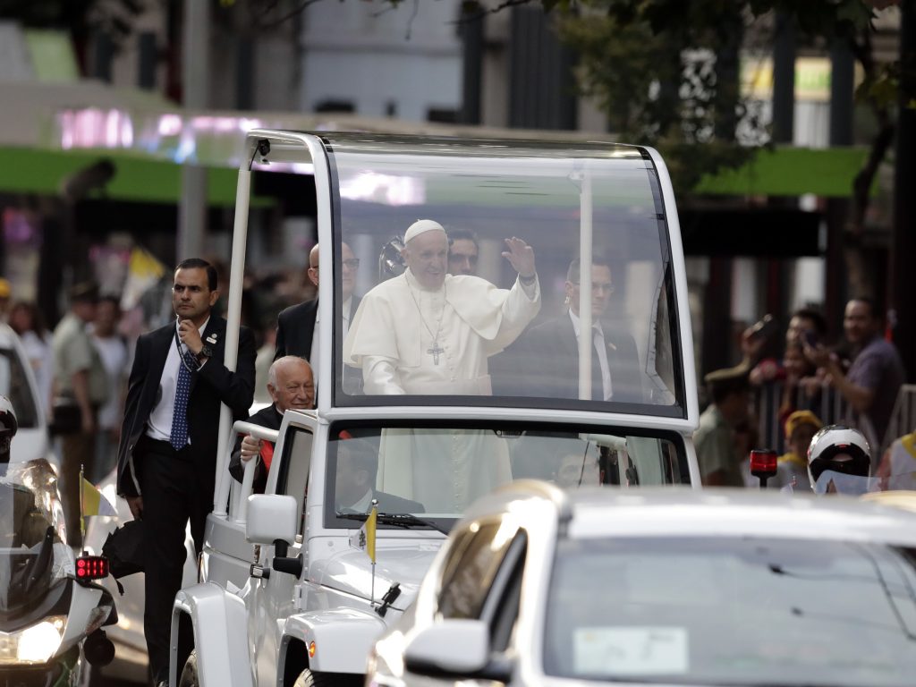 Pope Francis waves at followers on his way to the Apostolic Nunciature in Santiago, Chile, on Monday. Pope Francis waves at followers on his way to the Apostolic Nunciature in Santiago, Chile, on Monday.