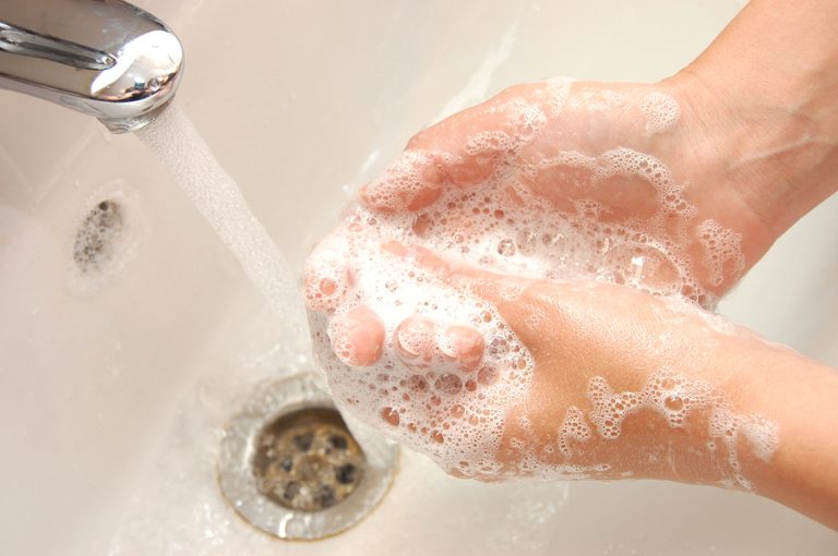 Woman Washing Hand Under Running