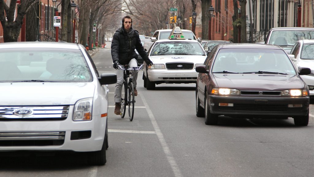 cars-regularly-stop-in-philadelphia-s-bike-lanes-that-aren-t-protected-by-delineator-posts-emma-lee-whyy.original-e1515451453518.jpg Cars and trucks parked in the bike lanes on Spruce and Pine streets force cyclists to take risky dodges into traffic.