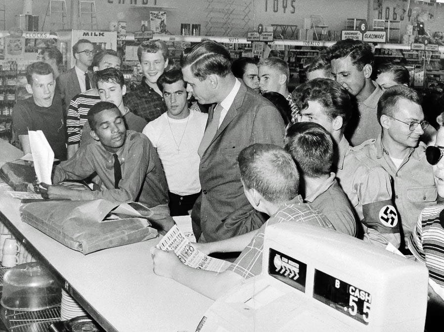 Dion Diamond listens with his eyes closed to George Lincoln Rockwell, the founder of the American Nazi Party, at a “whites-only” lunch counter in Arlington, Va., in 1960. Dion Diamond listens with his eyes closed to George Lincoln Rockwell, the founder of the American Nazi Party, at a