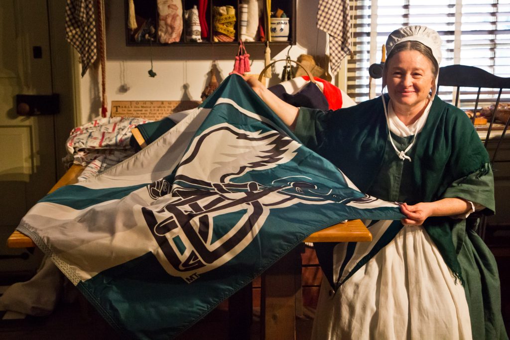 eagles 18 A Betsy Ross reenactor sews an Eagles flag the Monday before the Philadelphia football team heads to the Super Bowl.