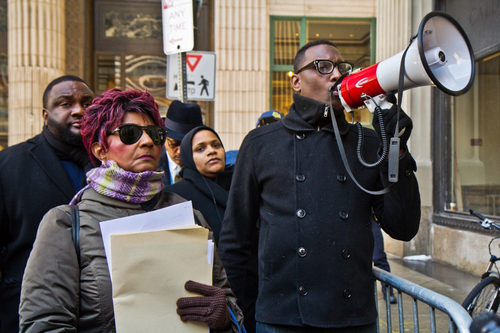 eric riddick Christine Riddick, mother of Eric Riddick, (left) his wife Dana Baker-Riddick, (center) and Black Lives Matter activist Asa Khalif protest outside the Philadelphia district attorney’s office in an attempt to deliver information they say will prove the innocence of Eric Riddick, who’s been incarcerated for 26 years. (Kimberly Paynter/WHYY)