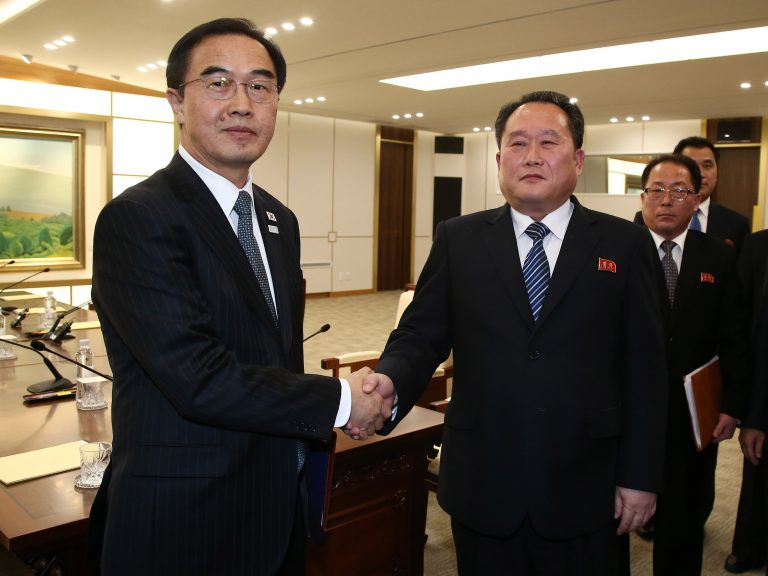 South Korea's Unification Minister Cho Myung-gyun, (left), shakes hands with North Korean chief delegate Ri Son Gwon after their meeting at the village of Panmunjom in the Demilitarized Zone dividing the two Koreas, on Tuesday. (AFP Photo / Korea pool/AFP/Getty Images)