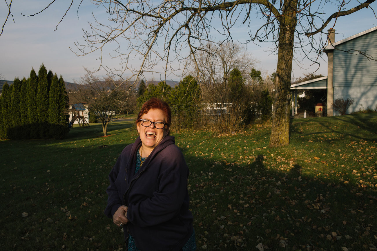 Pauline stands in her neighborhood. She is slowly adjusting to her new life away from Brooklyn.