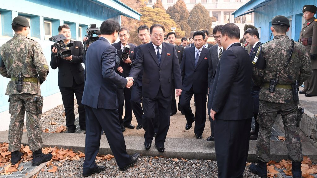 With North Korea planning to participate in the 2018 Winter Olympics, delegation head Jon Jong Su, vice chairman of the Committee for the Peaceful Reunification of the Country, crosses the concrete border to attend a meeting at the truce village of Panmunjom in the demilitarized zone separating the two Koreas. With North Korea planning to participate in the 2018 Winter Olympics, delegation head Jon Jong Su, vice chairman of the Committee for the Peaceful Reunification of the Country, crosses the concrete border to attend a meeting at the truce village of Panmunjom in the demilitarized zone separating the two Koreas.
(Yonhap via Reuters)