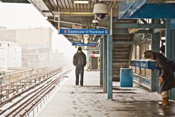 Commuters await the elevated train on the York-Dauphin platform. (Kimberly Paynter/WHYY)
