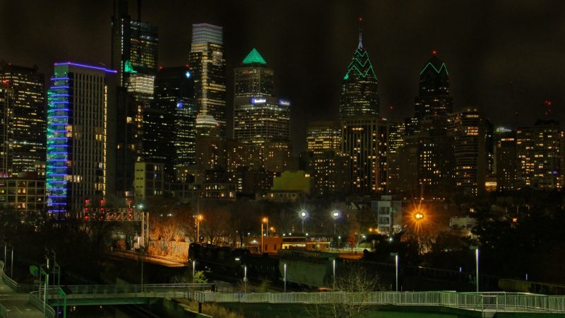 Many of Philadelphia's buildings are lit up with green lights in celebration of the Eagles' advancement to the Super Bowl. (Emma Lee/WHYY)