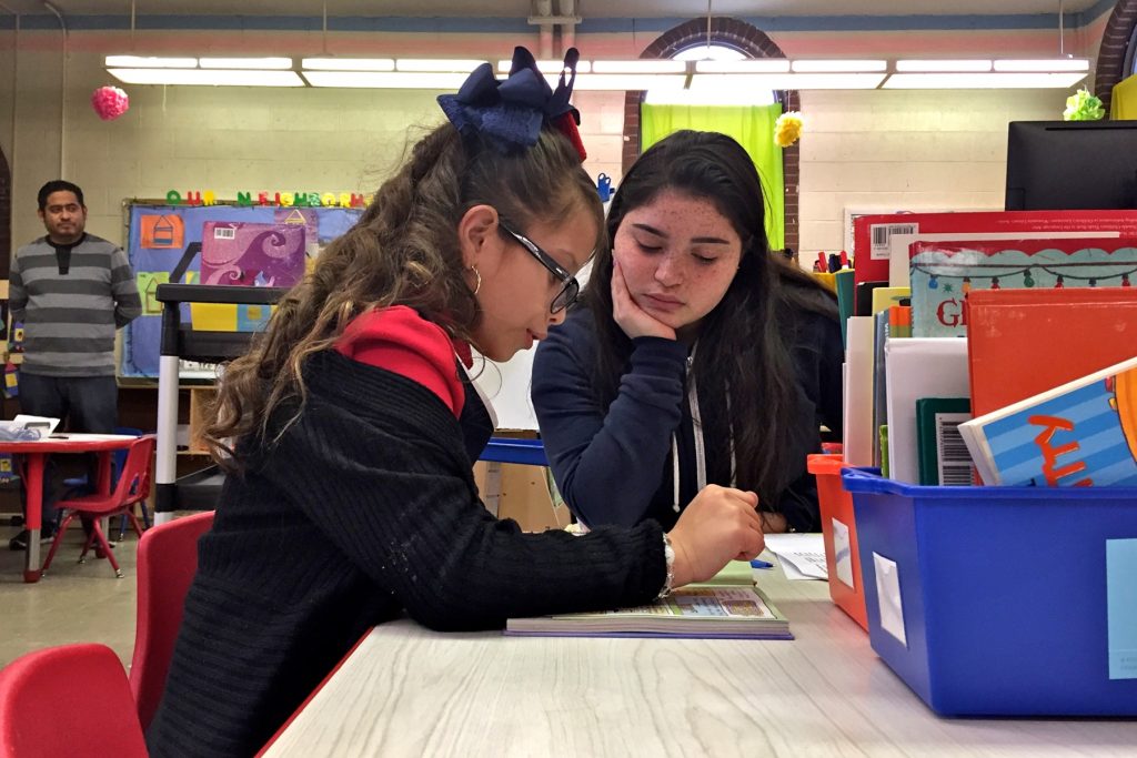 2018 02 20-a wolfman arent-philadelphia cramp elementary-after school reading High School senior Shalia Alejandro (center) helps Soriely Quinonez, a student at Cramp Elementary School.