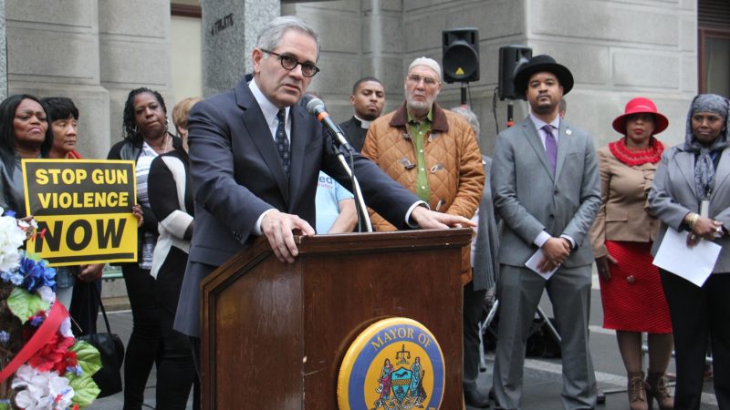 Philadelphia District Attorney Larry Krasner calls for a ban on assault rifles during a vigil for victims of gun violence at City Hall. (Emma Lee/WHYY)