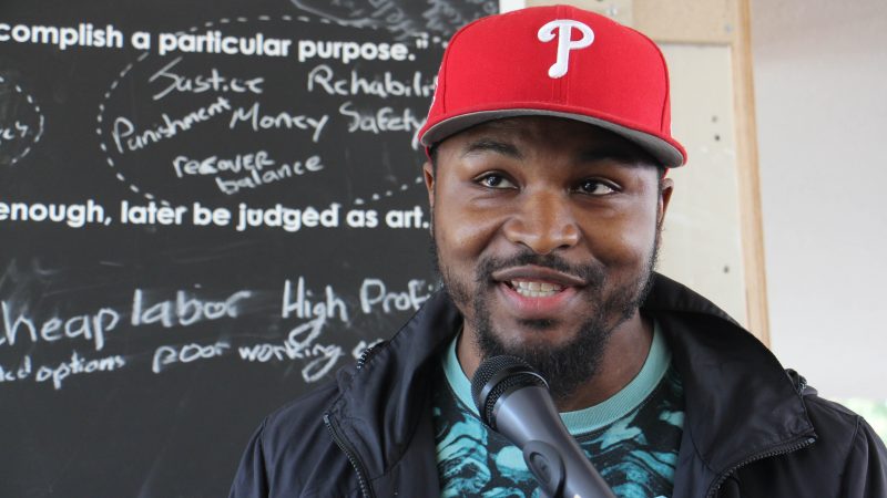 Mural Arts artist Russell Craig talks about his project exploring the constraints of the criminal justice system. (Emma Lee/WHYY)