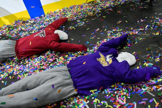 Puppets in Patriots and Vikings shirts are dragged behind an Eagles-themed float during the annual Wing Bowl competition, at the Wells Fargo Center, on Friday. (Bastiaan Slabbers for WHYY)