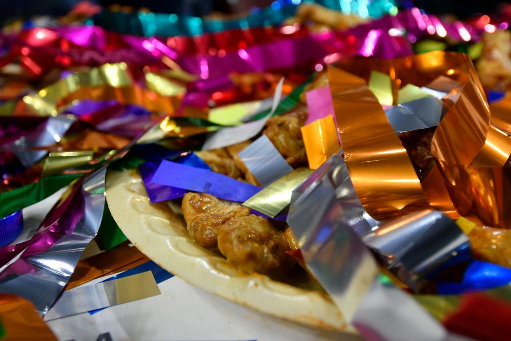Wing Bowl 26 Confetti covers left over wings after competitive eater Molly Schuyler takes the crown for winning the Wing Bowl 26, at the Wells Fargo Center, on Friday. (Bastiaan Slabbers for WHYY)