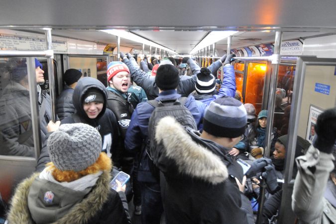 Fans pack subway cars as they head into Center City to watch the Eagles Superbowl Championship parade