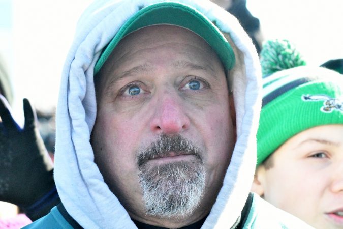 Fan tears up at the sight of the Eagles celebrating on stage as hundreds of thousands fill the Parkway in Philadelphia, PA, on February 8, 2018, to celebrate the Philadelphia Eagles winning Super Bowl LII. The Eagles beat the New England Patriots by 41-33. (Bastiaan Slabbers for WHYY)