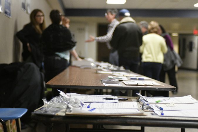 Rachel Reddick, Steve Bacher, and Scott Wallace, candidates for the Democratic nomination in the newly-drawn 1st Congressional District, attend a candidate forum in Newtown, Pa. on Tuesday evening. (Bastiaan Slabbers/for WHYY)