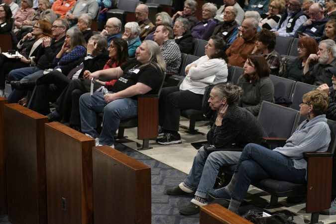 Audience members listen as candidates from the Democratic Party at a candidate forum react to audience questions. The forum is held the Council Rock High School North Auditorium in Newtown, Pa. on Tuesday evening. (Bastiaan Slabbers/for WHYY)
