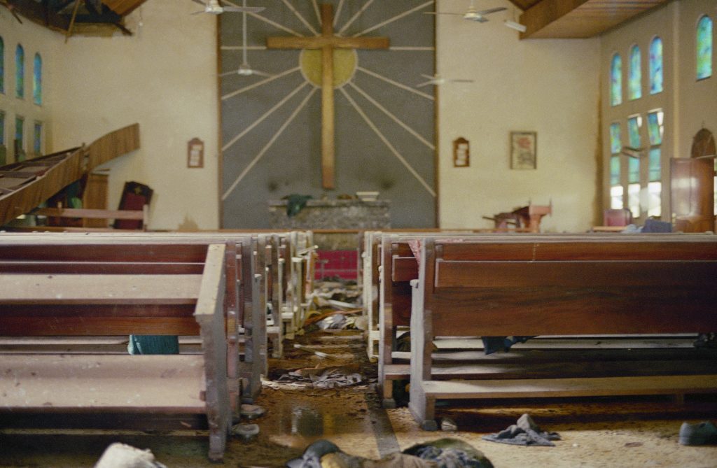 Rotting Corpses Rotting corpses of a woman and child at St. Peter's Lutheran Church in Monrovia, known as the Lutheran Church Massacre. Decomposing a long with those of hundreds of refugees massacred by soldiers of slain President Samuel Doe on July 30. This photography was taken mid October 1990. (Mark Huband/AP Photo)