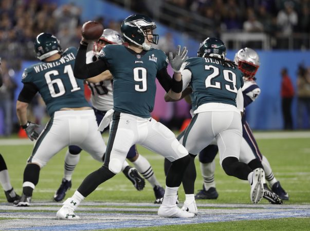 Philadelphia Eagles quarterback Nick Foles (9,) throws against the New England Patriots during the first half of the NFL Super Bowl 52 football game, Sunday, Feb. 4, 2018, in Minneapolis.