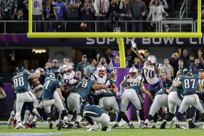 Philadelphia Eagles kicker Jake Elliott (4) kicks a field goal against the New England Patriots, during the first half of the NFL Super Bowl 52 football game Sunday, Feb. 4, 2018, in Minneapolis. Philadelphia Eagles punter Donnie Jones (8), holds. (AP Photo/Chris O'Meara)