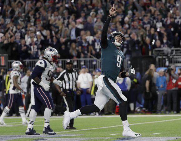 Philadelphia Eagles quarterback Nick Foles (9) celebrates after throwing a touchdown pass to Alshon Jeffery during the first half of the NFL Super Bowl 52 football game against the New England Patriots Sunday, Feb. 4, 2018, in Minneapolis. (AP Photo/Matt Slocum)