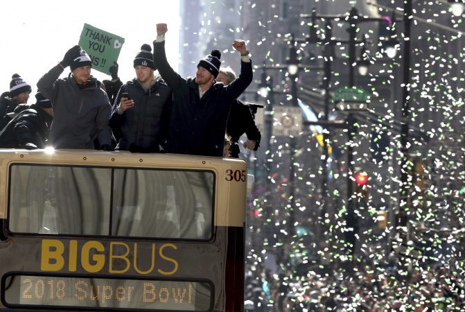 Philadelphia Eagles NFL football team quarterbacks Nick Foles, left, Nate Sudfeld, center and Carson Wentz ride in the Eagles team parade and celebration Thursday Feb. 8, 2018, in Philadelphia. The Eagles defeated the New England Patriots in Super Bowl 52. (AP Photo/Jacqueline Larma)