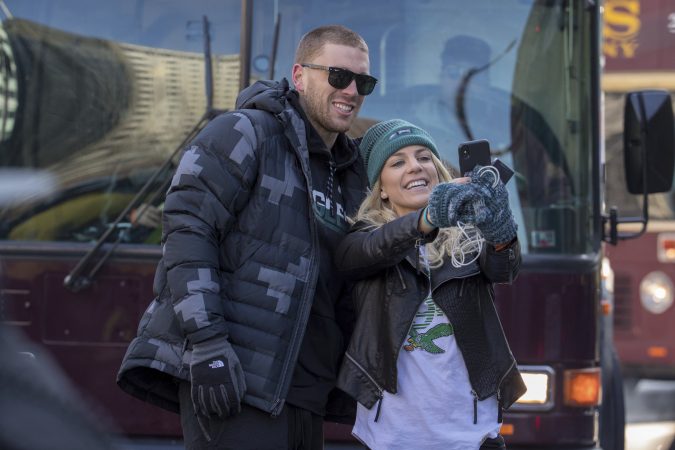 Philadelphia Eagles NFL football player Zach Ertz, left, stops to take a photo with his wife, Julie Ertz, during a Super Bowl victory parade, Thursday, Feb. 8, 2018, in Philadelphia. The Eagles beat the New England Patriots 41-33 in Super Bowl 52. (AP Photo/Christopher Szagola)
